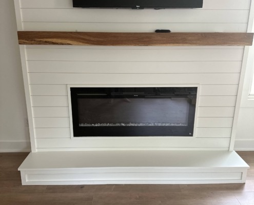 a fireplace with a flat screen tv above it